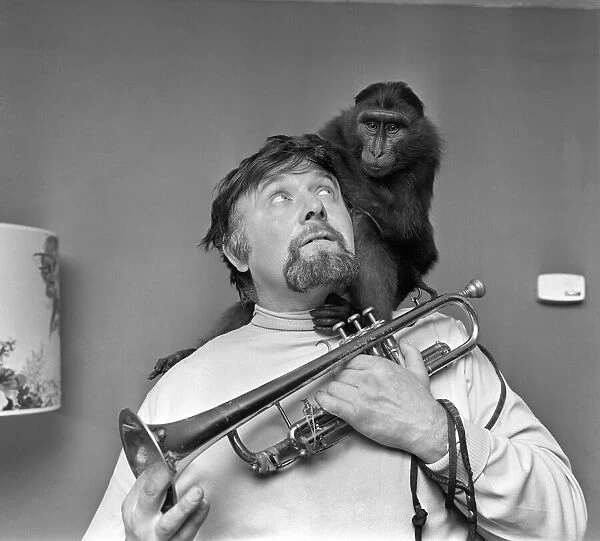 Bandleader and rugby supporter Ernest Baker with cheeky Abyssinian mountain ape on his