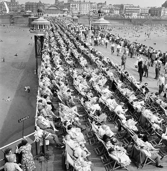 Bank holiday at Blackpool. Beach scenes  /  crowds  /  sunbathing. June 1960 M4319-014