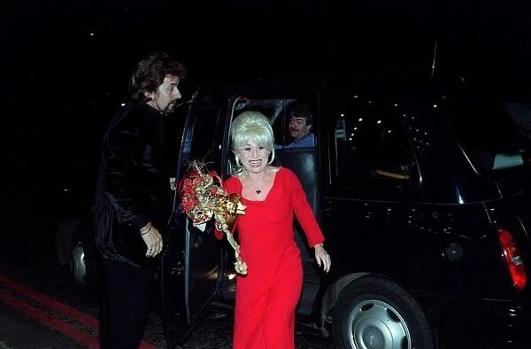Barbara Windsor actress November 1998, Eastenders actress getting out of black taxi