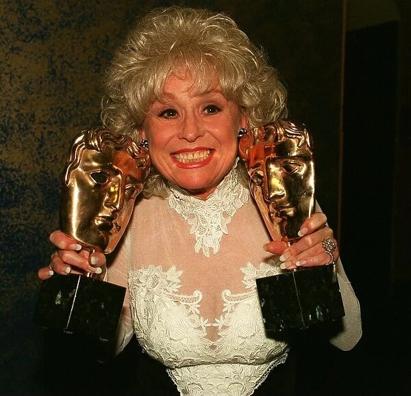 Barbara Windsor holding Bafta awards after Eastenders had won best Drama series