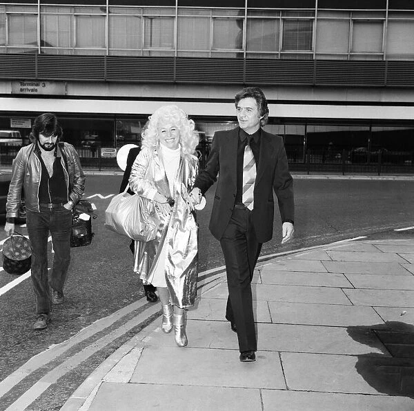 Barbara Windsor and her husband Ronnie Knight arriving at Heathrow Airport from Australia