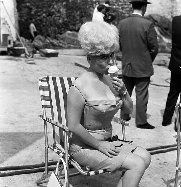Barbara Windsor, a tiny five feet nothing, is described as a cute