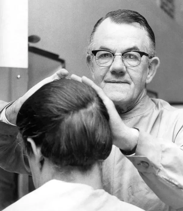 Framed Print : Barber Mr. Fisher hard at work within Bainbridges hairdressing salon in August 1969 Framed Print : Barber Mr. Fisher hard at work within Bainbridges hairdressing salon in August 1969