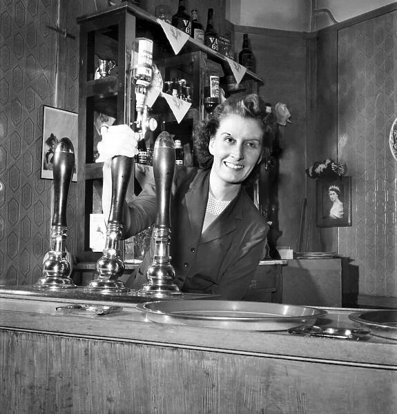 Barmaid pulls a pint. August 1953 D5333