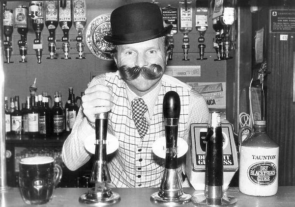 Barman Bobby Moore heavily disguised, poses for publicity picture at his East End pub