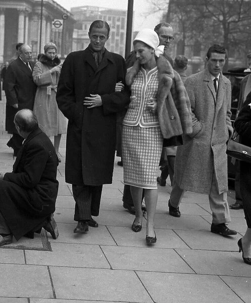 Baron Heinrich Thyssen with wife Fiona Campbell Walter walking in London 1961