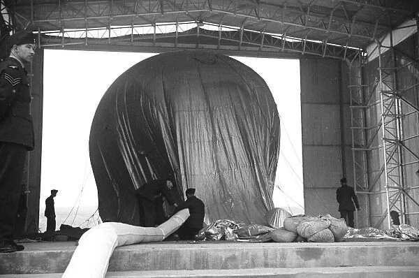 Barrage Balloon being filled in its hangar at Hook, Surrey. October 1938