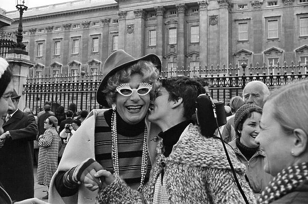 Barry Humphries in character as Dame Edna Everage outside Buckingham Palace, London