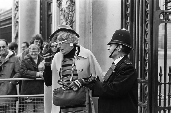 Barry Humphries in character as Dame Edna Everage outside Buckingham Palace, London
