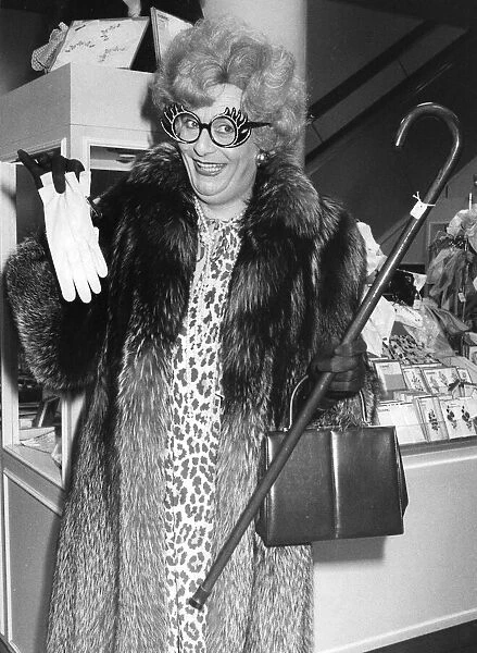 Barry Humphries as Dame Edna Everage outside the shop window at Selfridges