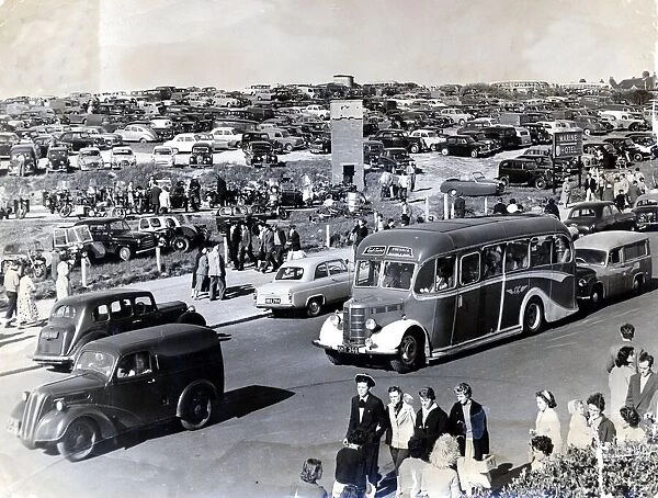 Barry Island - Car parks full as people, cars and buses flock to the beach. c. July 1959