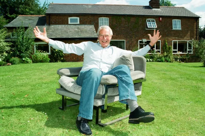 Framed Print : Barry Norman Film Critic seen here in the garden of his Datchworth home with the chair he Framed Print : Barry Norman Film Critic seen here in the garden of his Datchworth home with the chair he