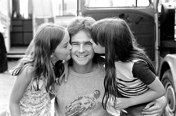 Barry Sheene gets a good luck kiss from Sonia Salmons (left aged 9