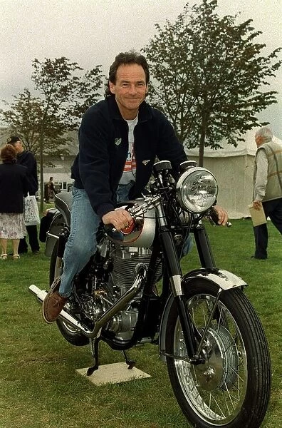 Barry Sheene September 1998. Former world motorcycle champion sitting on an old