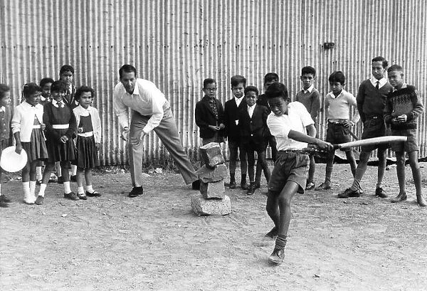 Basil D Oliveira Black South African Cricketer teaches the young black children
