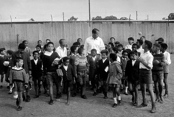 Basil D Oliveira Cricket Player in South Africa with a group of children
