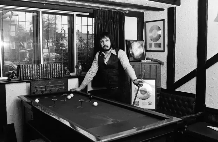 Framed Print : Bass guitarist of The Who rock group John Entwistle pictured at his home in Ealing
