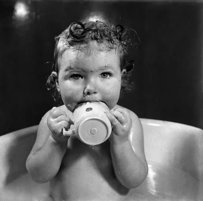 Framed Print : Bath time for one year old Kathleen Skelly is the happiest moments for her