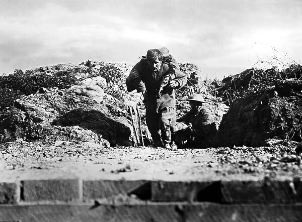 Battle of Albert: A wounded man of the 29th Division being brought in across a sunken