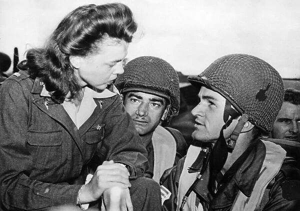 The Battle of Arnhem. American Paratroopers say goodbye to an Army nurse at an airport