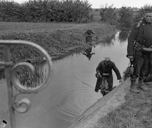 Battle of Hofstade. Belgian soldiers fill their water bottles at a river