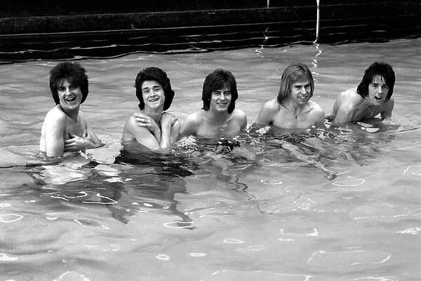 The Bay City Rollers celebrate their chart success with a quick dip in the pool