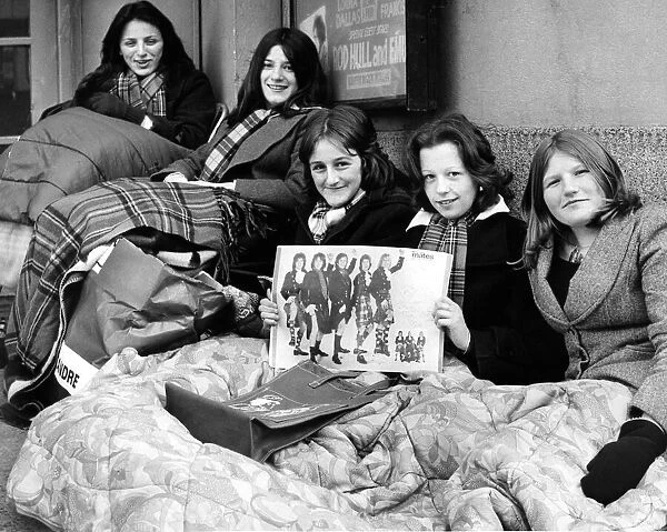 These five Bay City Rollers fans settle down this morning for a 28-hour wait outside