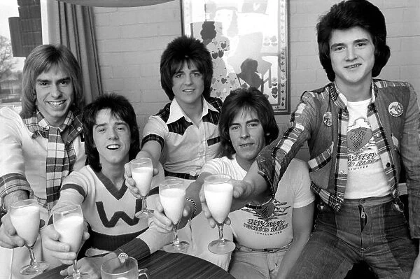 Bay City Rollers (Non-Drinkers) toast their success with milk. L. to R