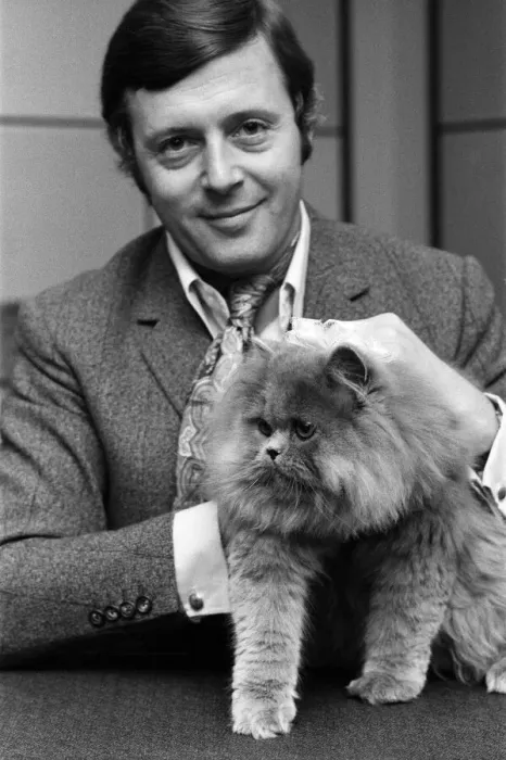 Framed Print : BBC commentator Michael Aspel at the BBC Studios at Lancaster Gate with a cat who is a Framed Print : BBC commentator Michael Aspel at the BBC Studios at Lancaster Gate with a cat who is a