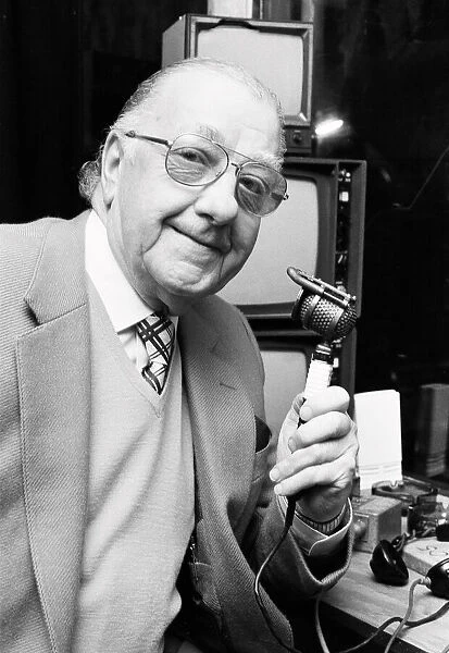 BBC snooker commentator Ted Lowe holding his microphone. 27th January 1986