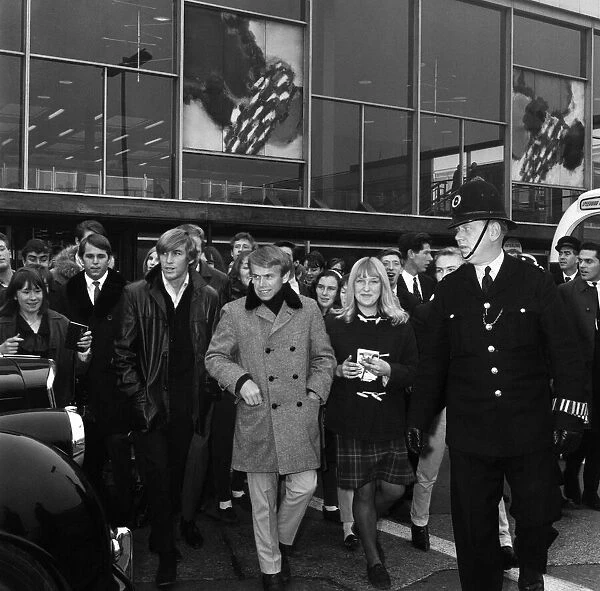 The Beach Boys arrived at London airport. Their recording of I Get Around