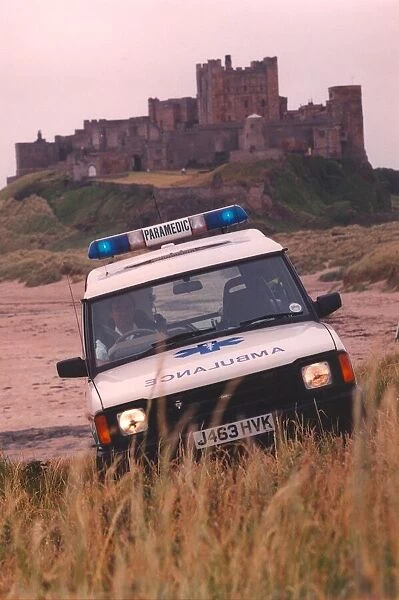 Beach combing - one of the new 4 wheel drive ambulances in action at Bamburgh Castle