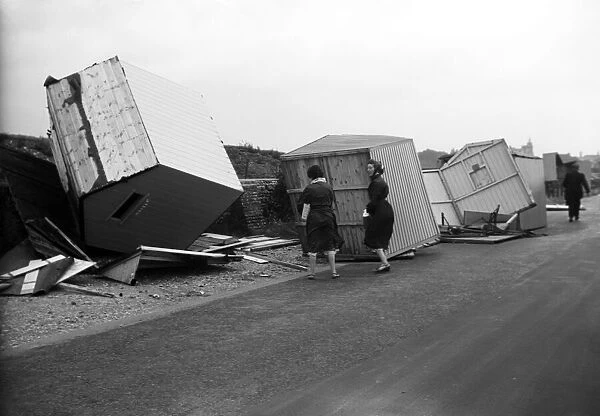 Beach huts wreaked at Littlehampton, West Sussex. 29th July 1956
