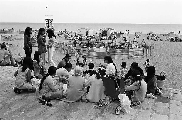 Beach scenes in Ramsgate. Holidaymakers in a 'village circle'