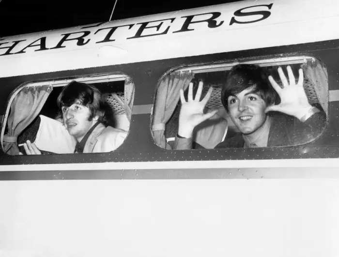 Framed Print : Beatle members Ringo Starr (left) and Paul McCartney look out of the window of plane Framed Print : Beatle members Ringo Starr (left) and Paul McCartney look out of the window of plane