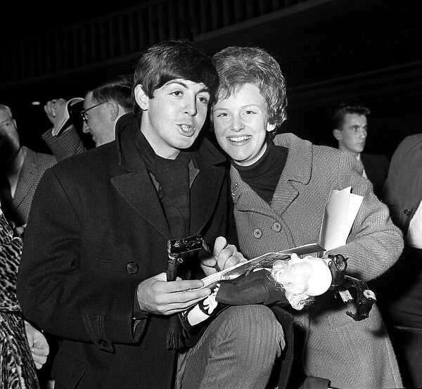 The Beatles 8th November 1963. Paul McCartney signing autographs for unknown woman
