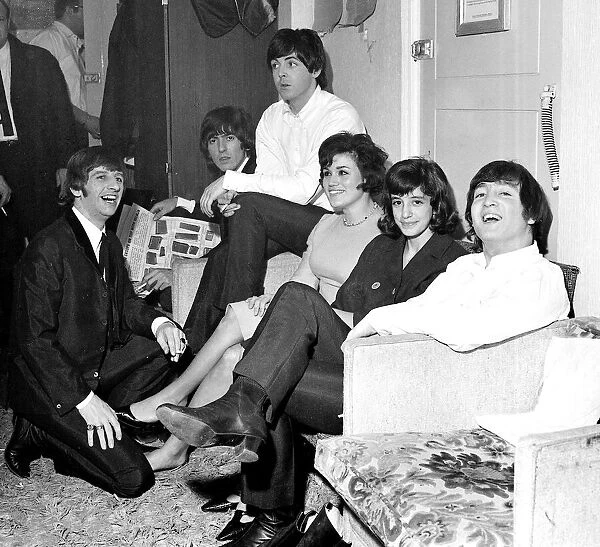 The Beatles with two american fans who flew to London to see Another Beatles christmas