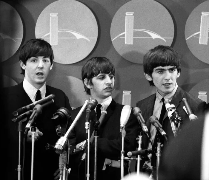 Framed Print : The Beatles answer questions for newsmen and journalists in New York after their arrival