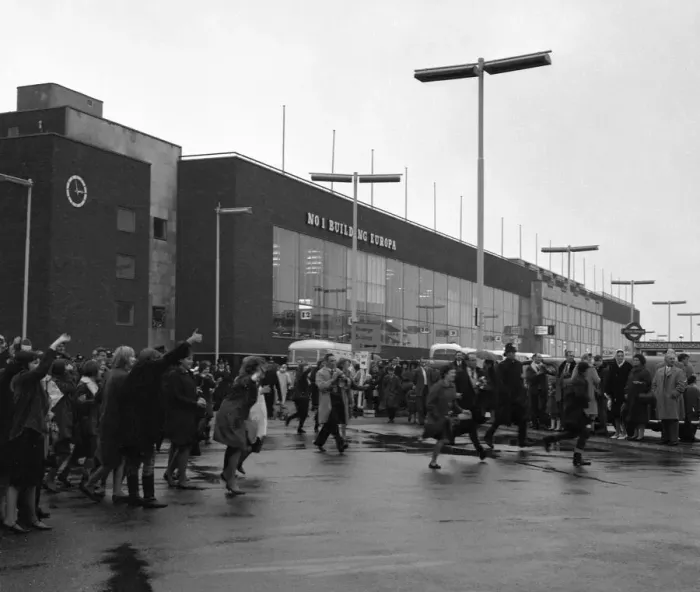 Framed Print : The Beatles arrive at London airport from Sweden. Fans running across the airport to Framed Print : The Beatles arrive at London airport from Sweden. Fans running across the airport to