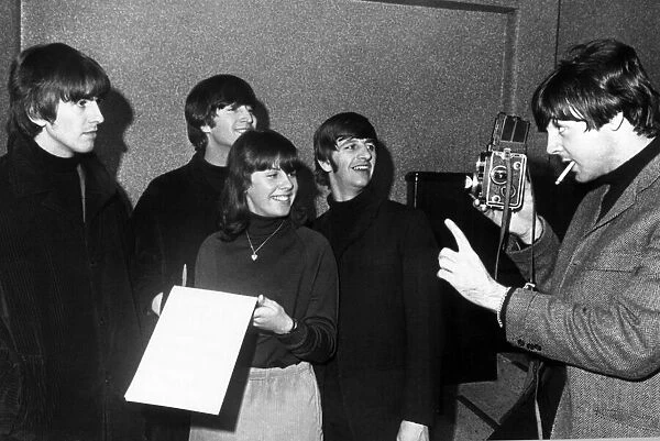 The Beatles with artist Marilyn Piller 19, who had her picture taken with George