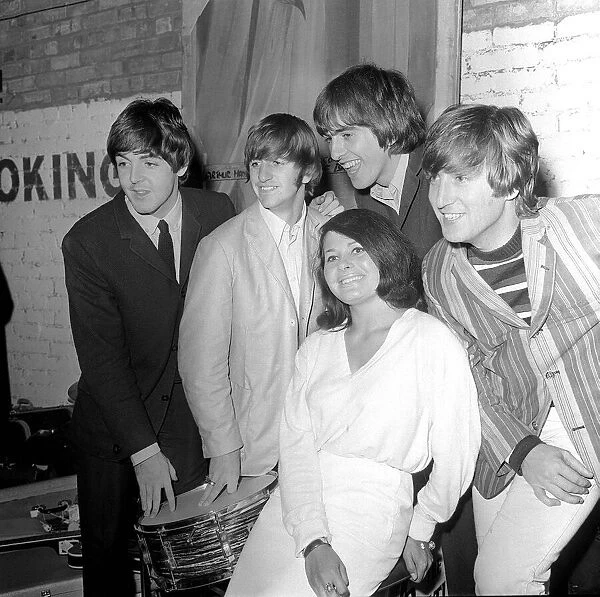The Beatles backstage at the Futurist theatre in Scarborough with Cherry Rowland one of