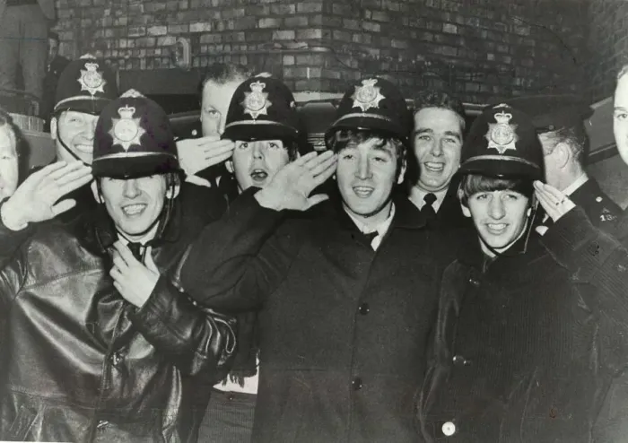 Framed Print : The Beatles clown dressed in policemen helmets used to smuggle them into the Birmingham