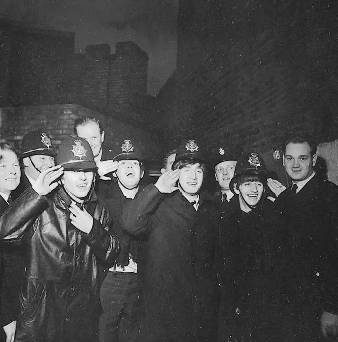 Framed Print : The Beatles clown dressed in policemen helmets used to smuggle them into the Birmingham
