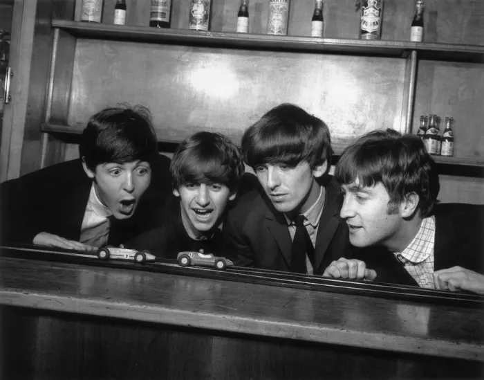 Framed Print : The Beatles in Coventry, amusing themselves with a miniture car race track before their Framed Print : The Beatles in Coventry, amusing themselves with a miniture car race track before their