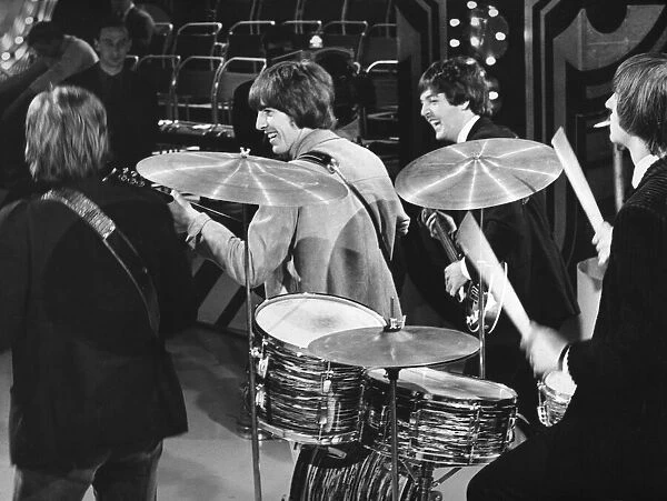 The Beatles... drummer Ringo smokes and Paul and George (centre
