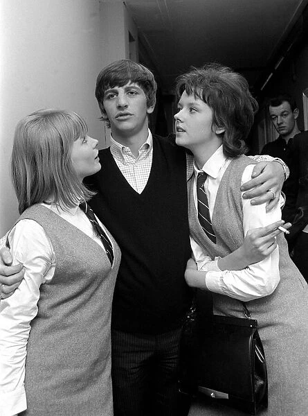 Beatles drummer Ringo Starr with two actresses at Twickenham film studios, February 1964