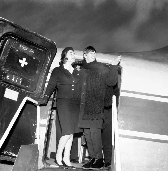 Framed Print : Beatles drummer Ringo Starr with air stewardess as he boards a plane