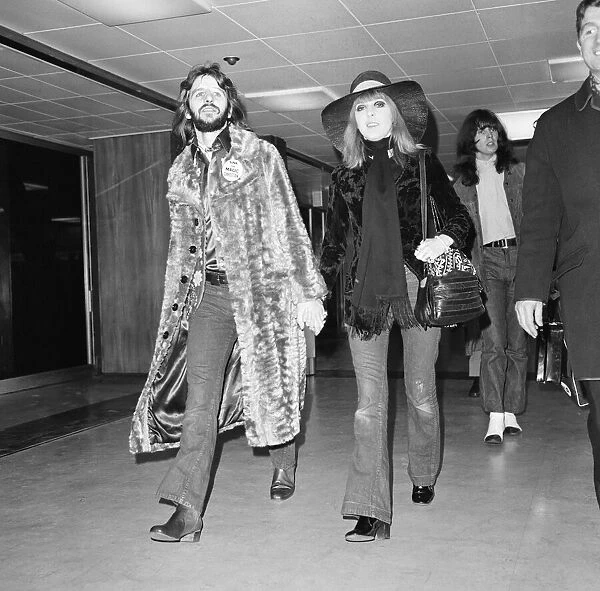 Former Beatles drummer Ringo Starr at Heathrow airport with his wife Maureen en route