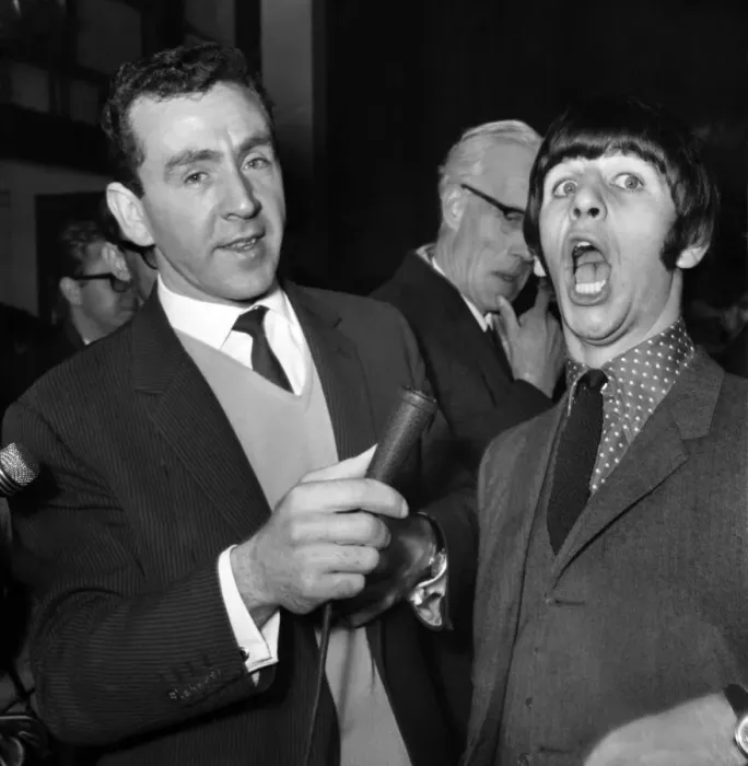 Framed Print : Beatles drummer Ringo Starr shows off his tonsils to the press before entering Framed Print : Beatles drummer Ringo Starr shows off his tonsils to the press before entering