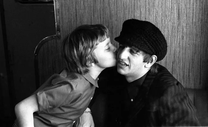 Framed Print : The Beatles February 1964 Beatles drummer Ringo Starr receives a kiss from a young Framed Print : The Beatles February 1964 Beatles drummer Ringo Starr receives a kiss from a young
